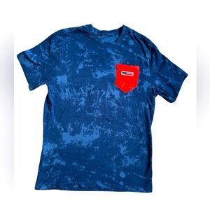 The Nike Tee in red, white and blue tie dye like pattern size medium